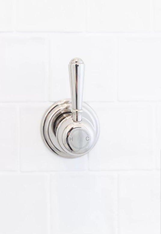 Silver chromatic tapware within the bathroom renovation