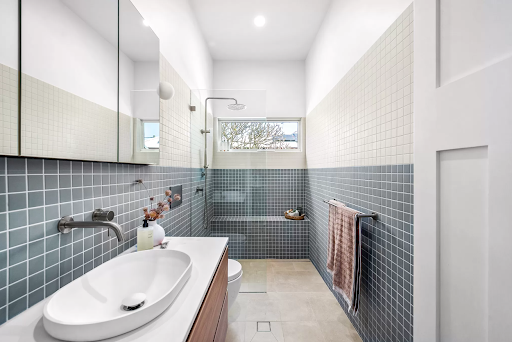 Small bathroom renovation with statement tiling